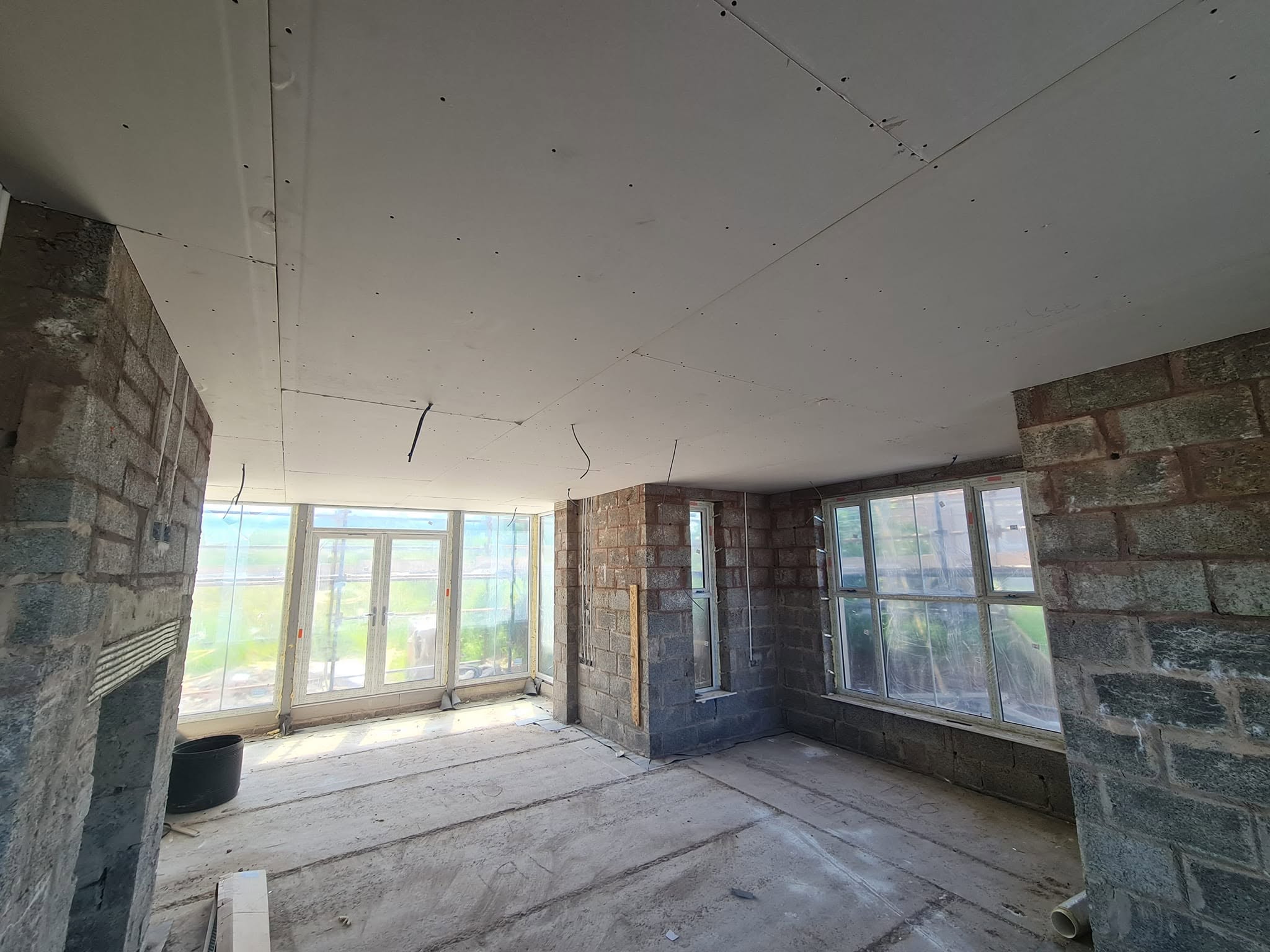 Plasterboard ceiling being installed in private property