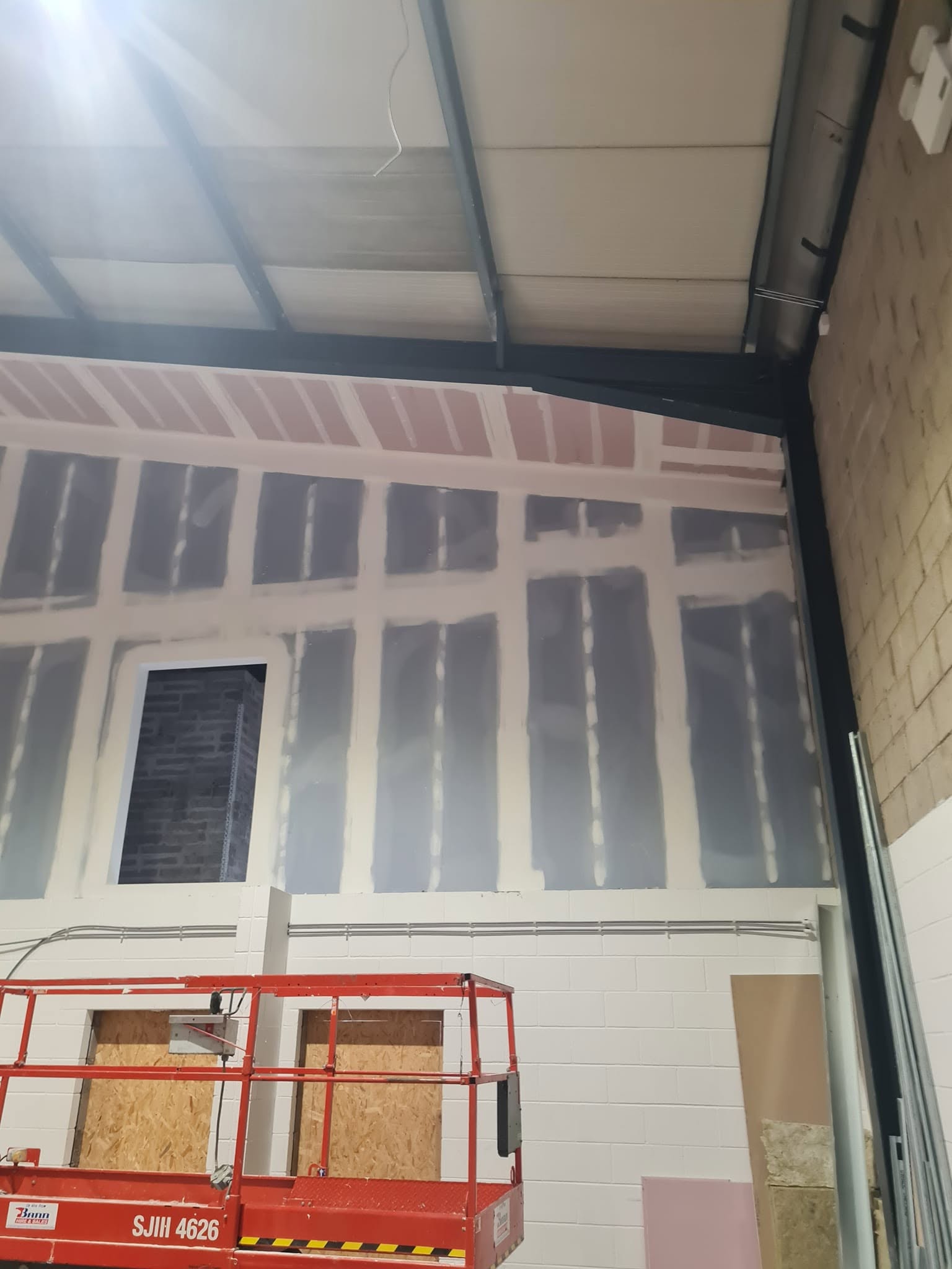 Dry lining installation in commercial interior